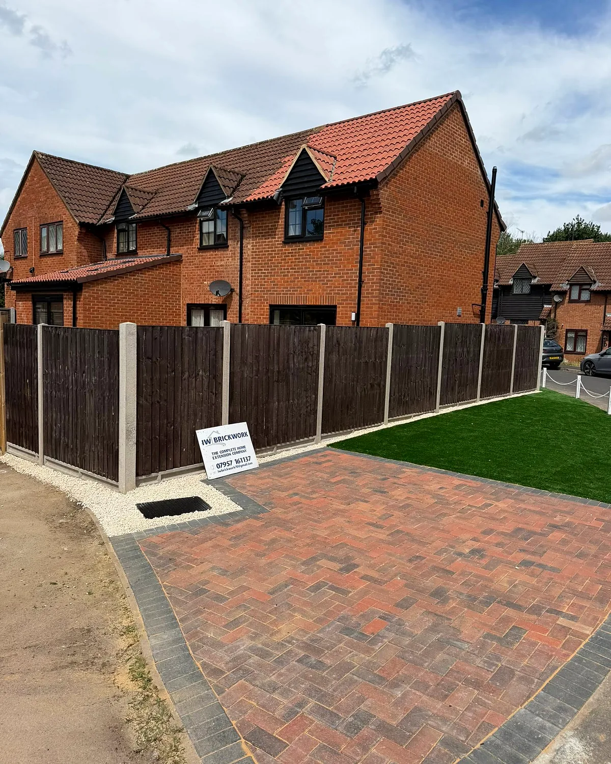 Paving, lawn and the new fence line