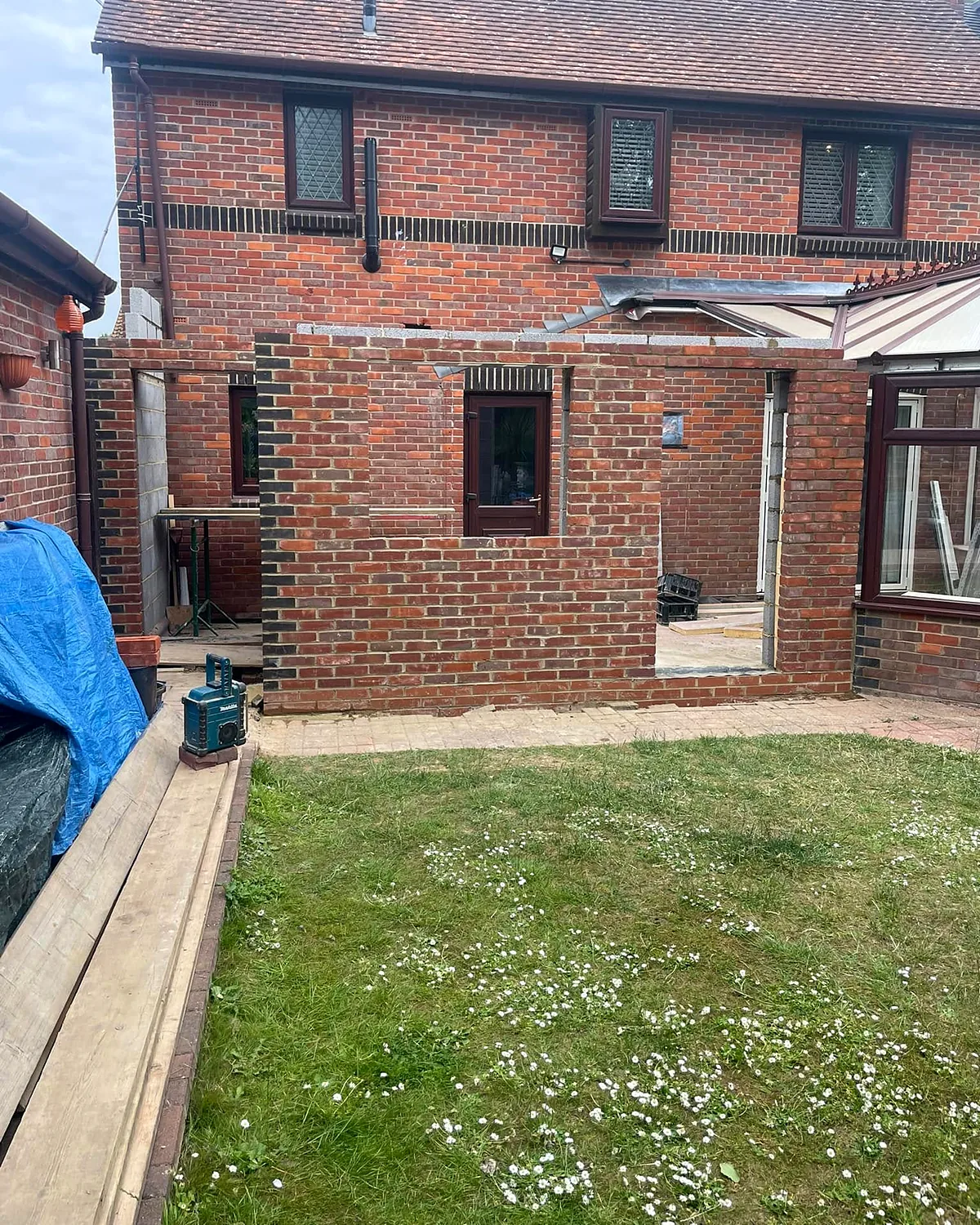 Brickwork: Brick and block walls up beside the existing conservatory.