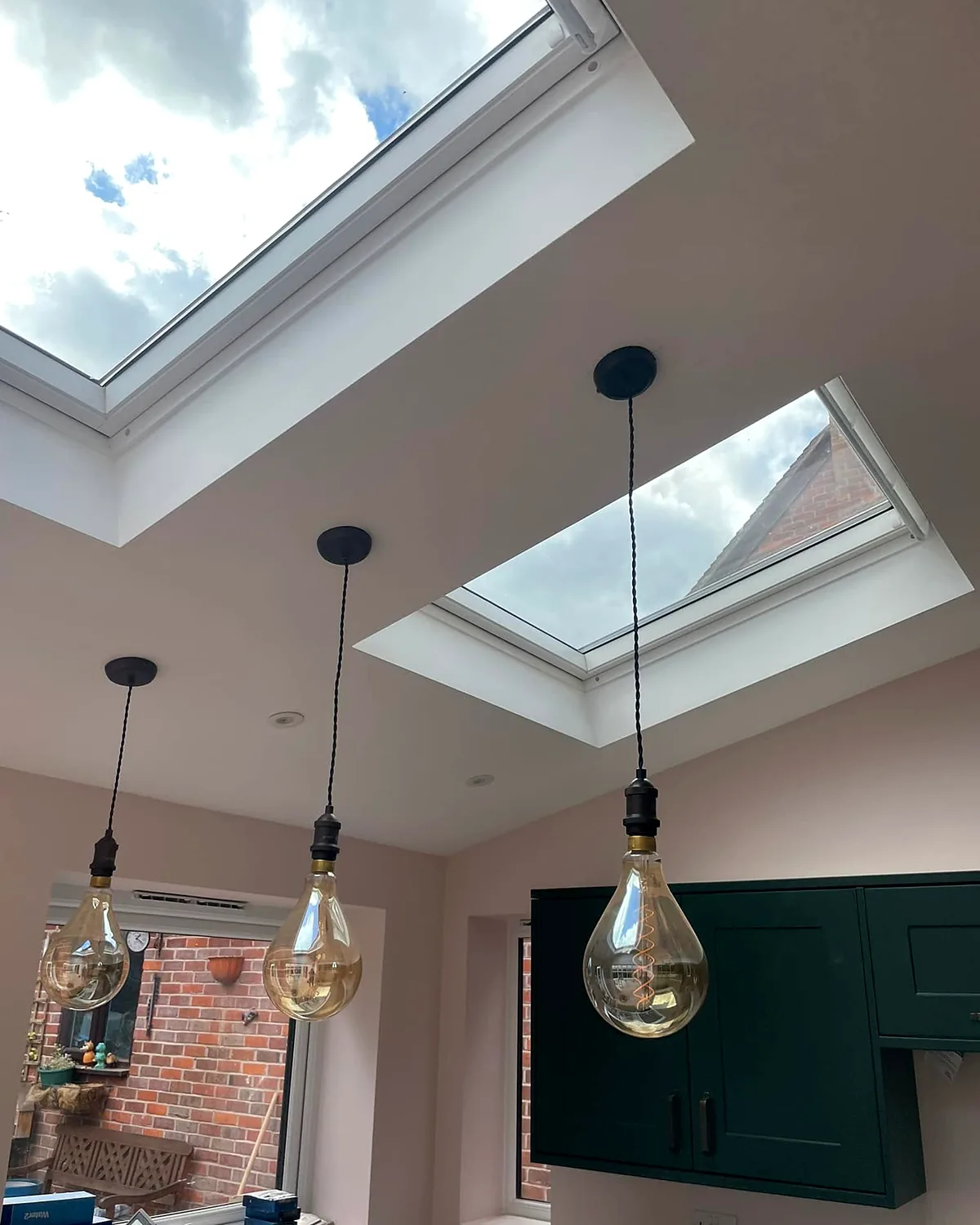 Rooflights and plaster: Rooflights in, walls plastered, pendant lights hung.