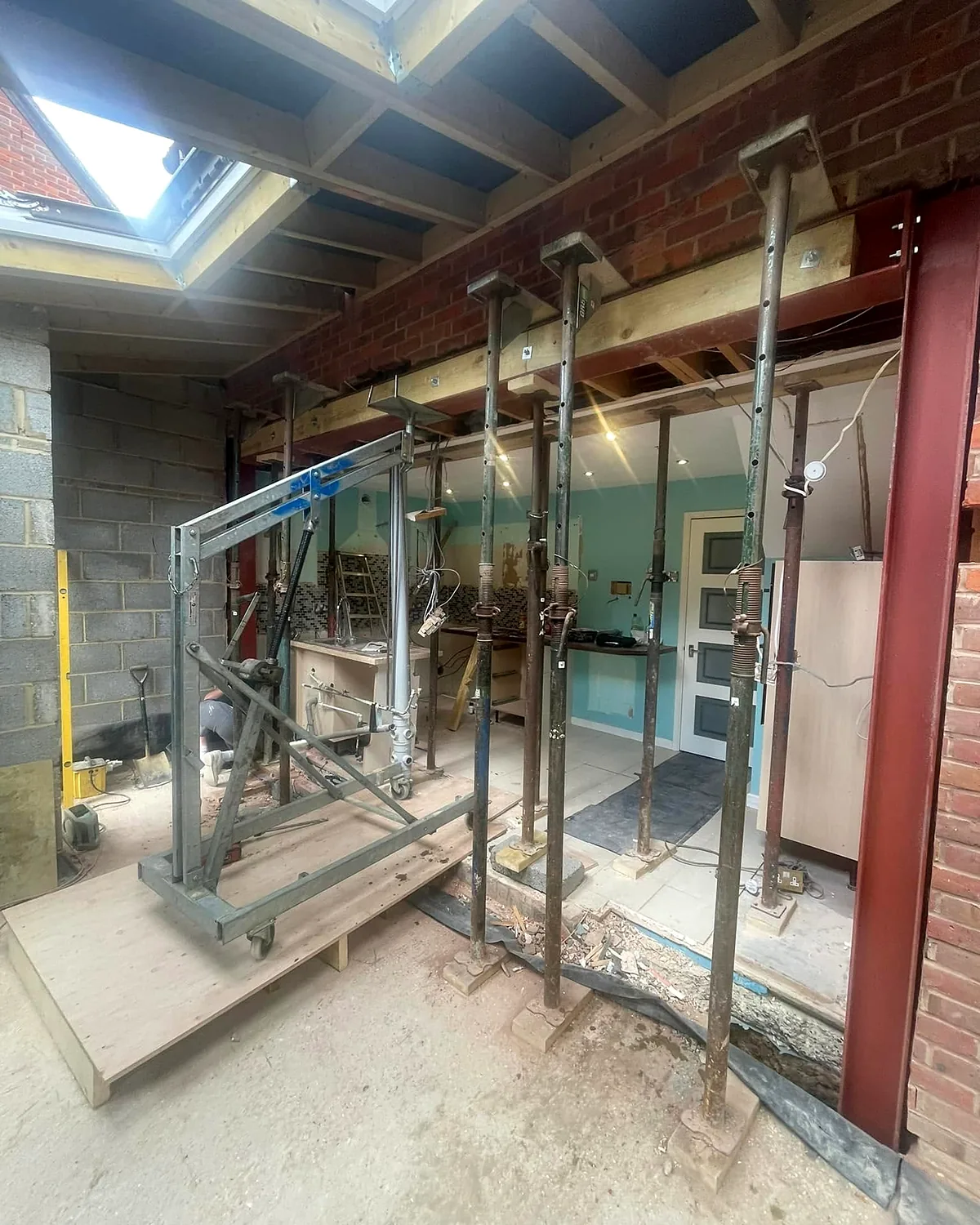 Steels and openings: Props, steels and the frame for the new bifold doors.